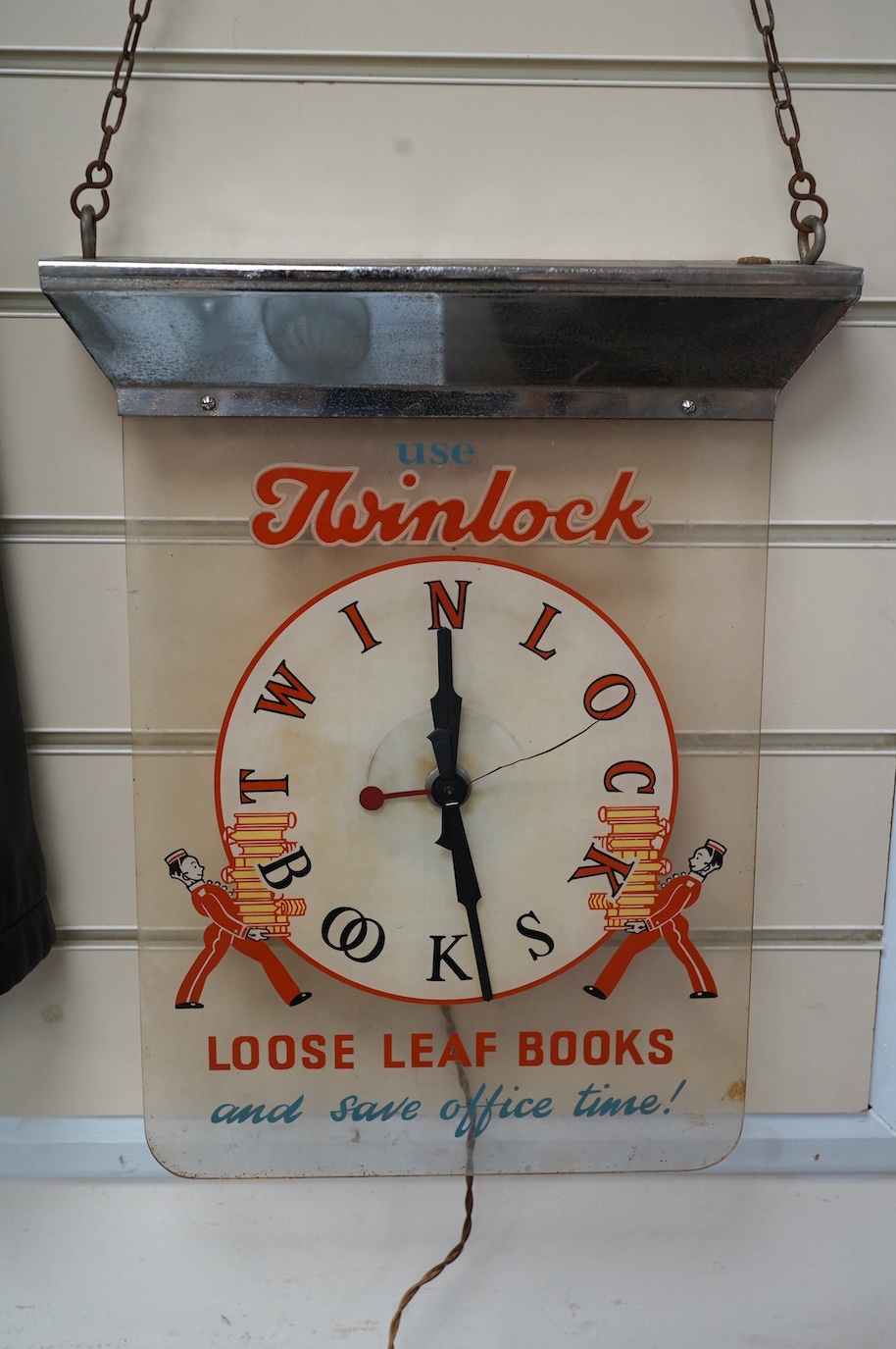 A mid century Twinlock advertising hanging timepiece, 42cm long. Condition - fair, not tested